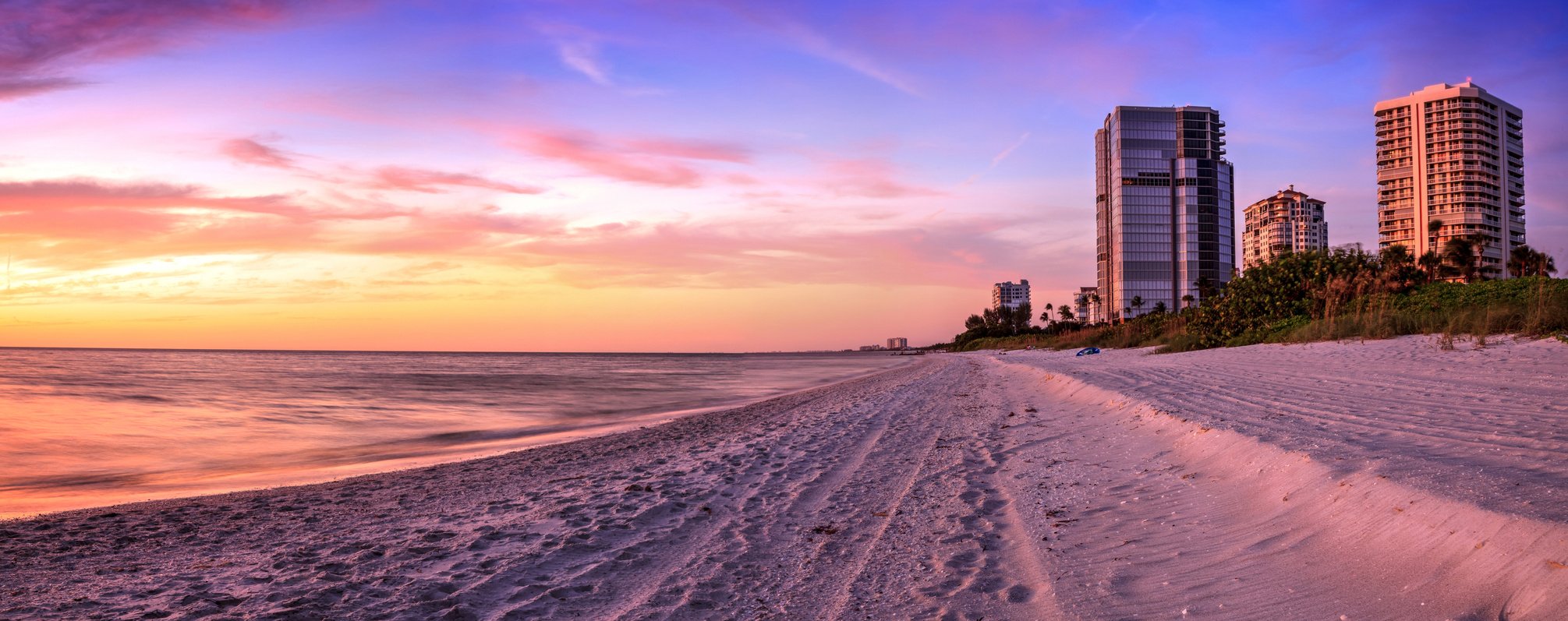 Sunset over North Gulf Shore Beach along the coastline of Naples